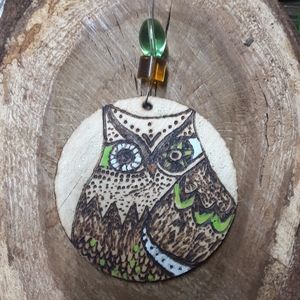 Woodburnt and painted ornament